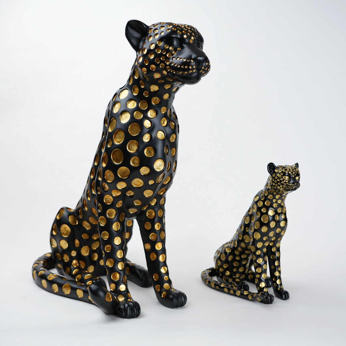 Black leopard decor object with silver spots and gold detailing