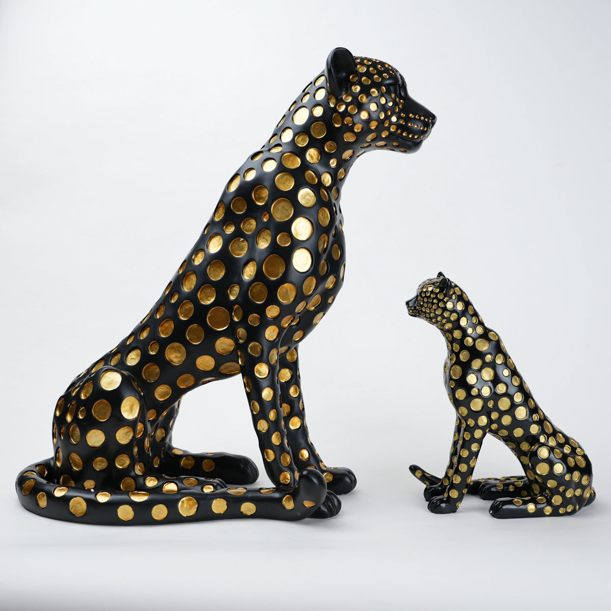 Black leopard decor object with silver spots and gold detailing