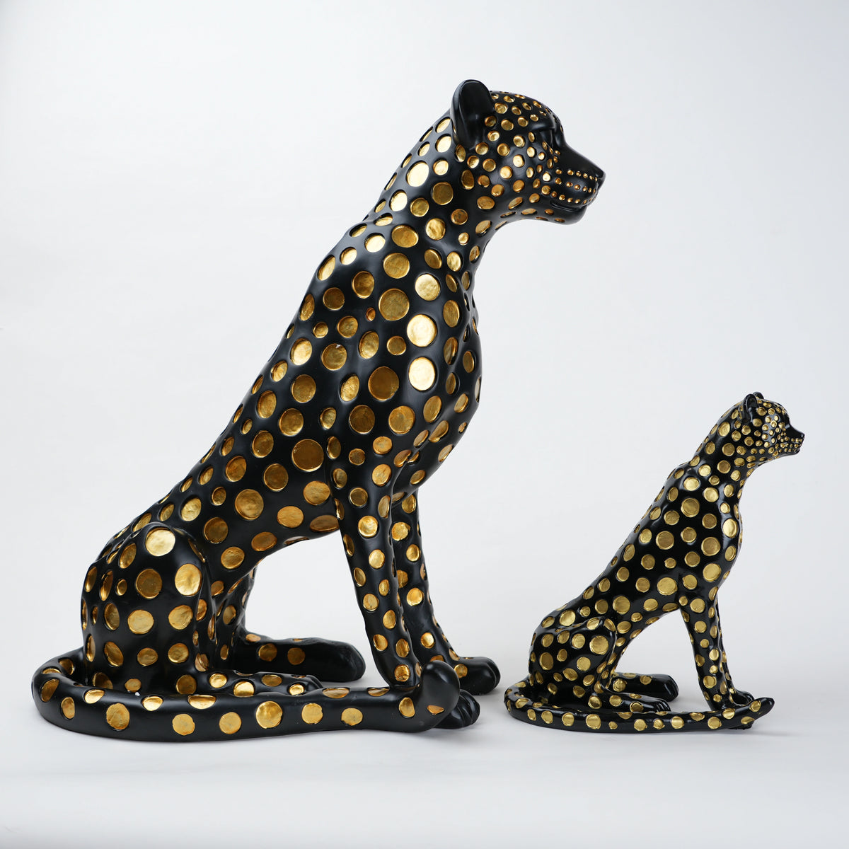 Black leopard decor object with silver spots and gold detailing