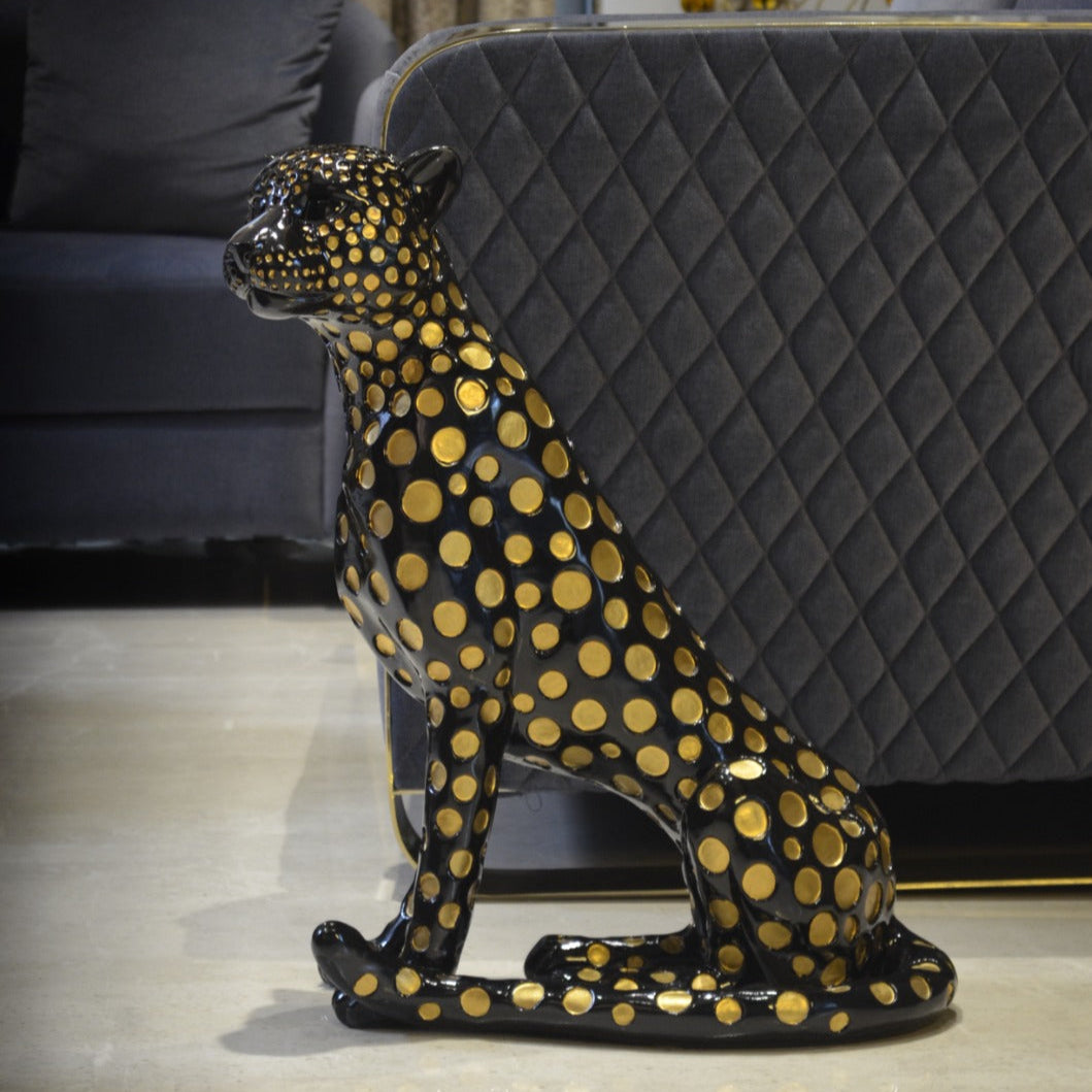 Black leopard decor object with silver spots and gold detailing