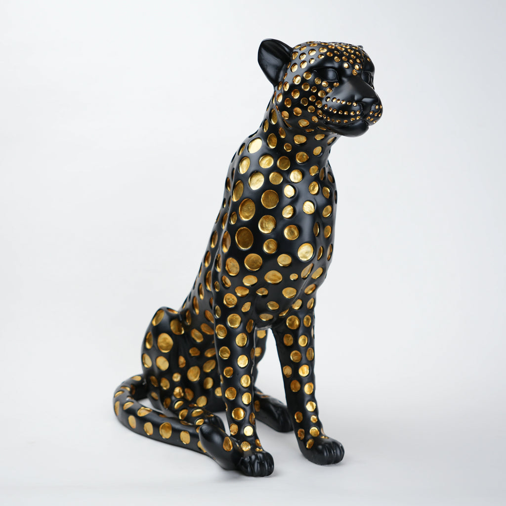 Black leopard decor object with silver spots and gold detailing