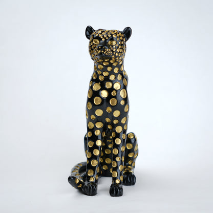 Black leopard decor object with silver spots and gold detailing