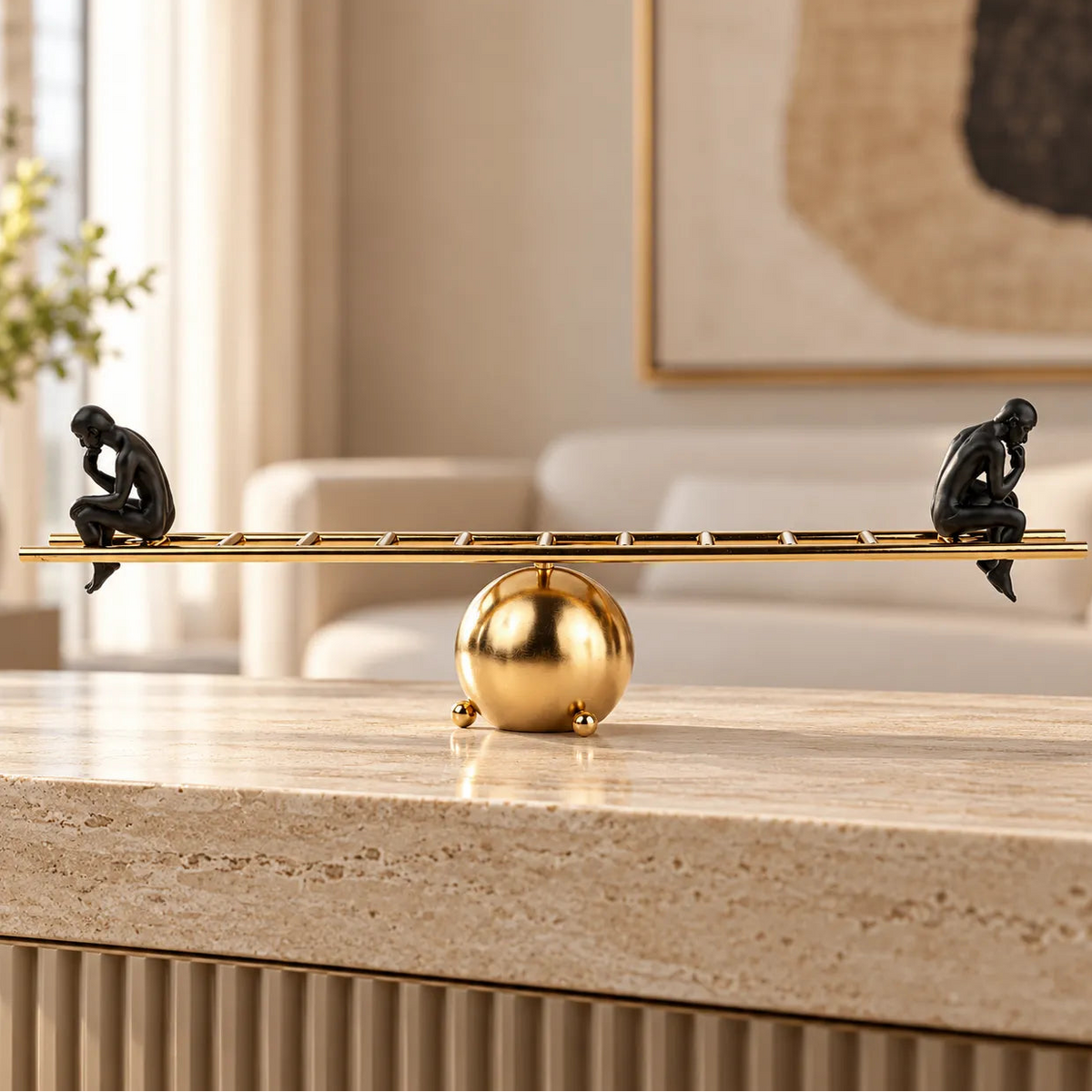Two black contemplative figurines on a gold ladder-inspired decorative sculpture.
