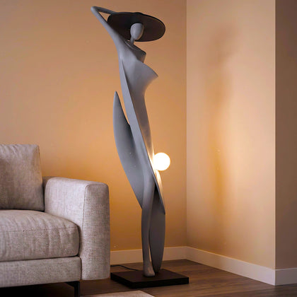 Bluish grey lady sculpture floor lamp with black hat and glowing orb – modern artistic lighting.