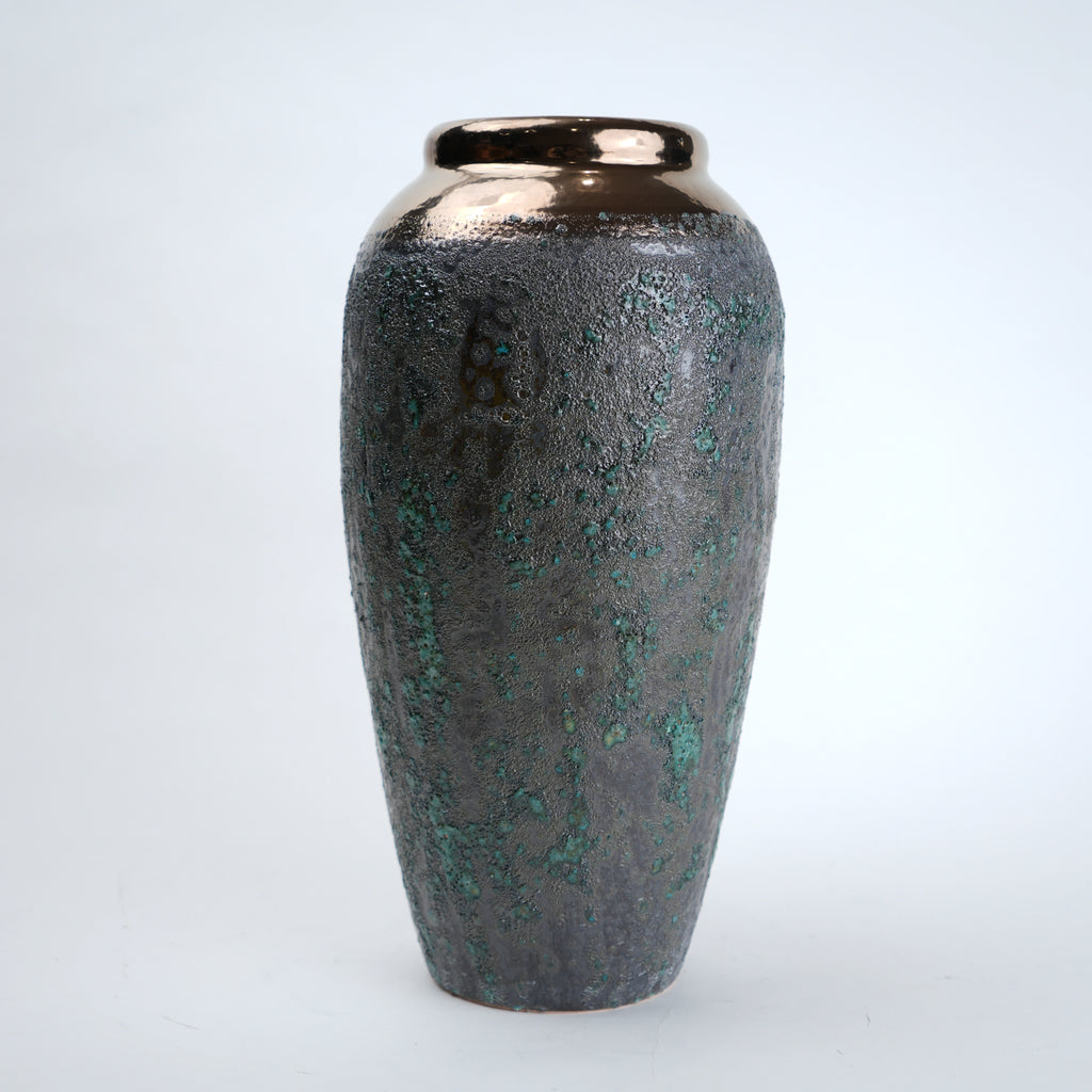 Decorative vase with a textured surface on a white background