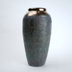 Decorative vase with a textured surface on a white background