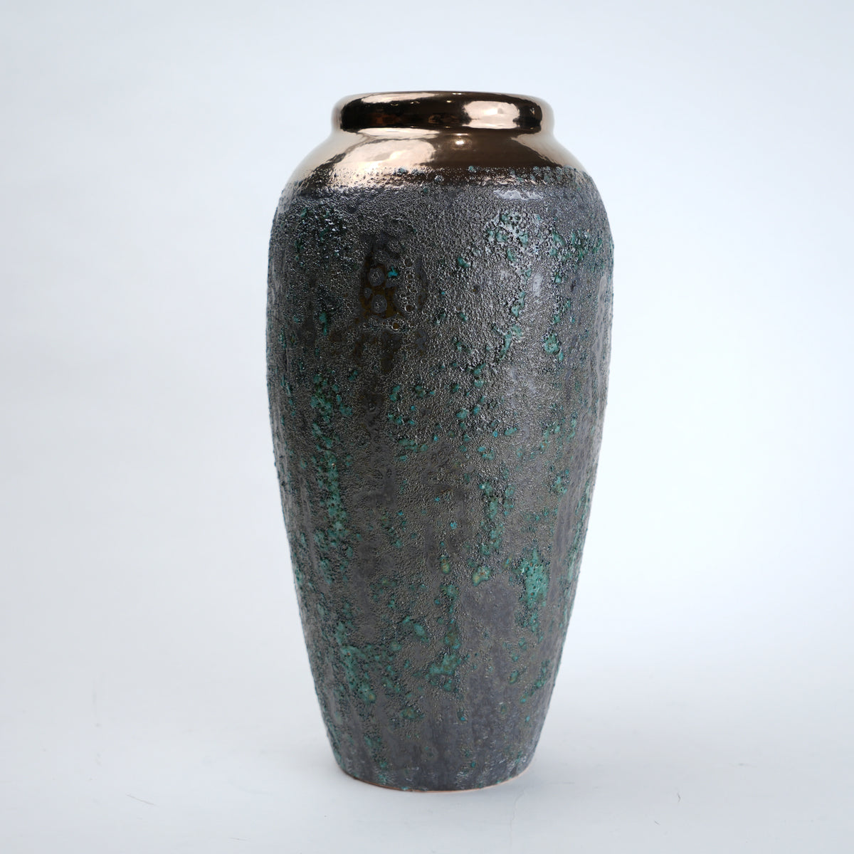 Decorative vase with a textured surface on a white background