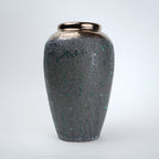green charcoal ceramic vase with patina texture and bronze neck