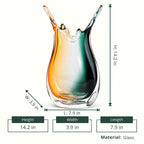 Glass vase with a gradient from green to orange on a white background