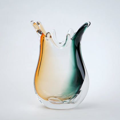 Green clear dual tone glass vase with an organic shape and uneven rim, featuring a thick base and smooth blended finish for modern home decor.