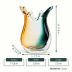 Glass vase with a gradient from green to orange on a white background