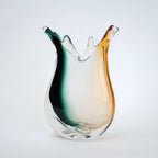 Green yellow glass vase with flowing curved edges