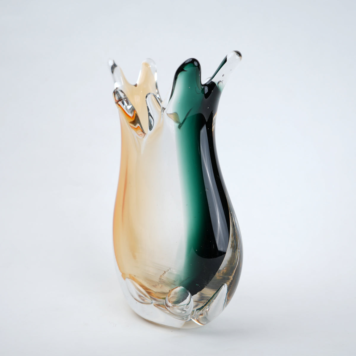 Glass vase with multicolored gradient on a white background