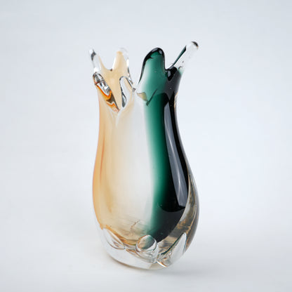 Glass vase with multicolored gradient on a white background