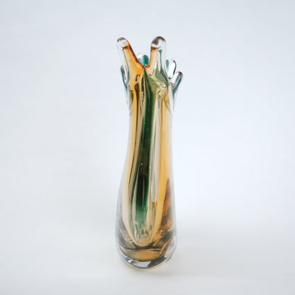 Glass vase with multicolored design on a white background