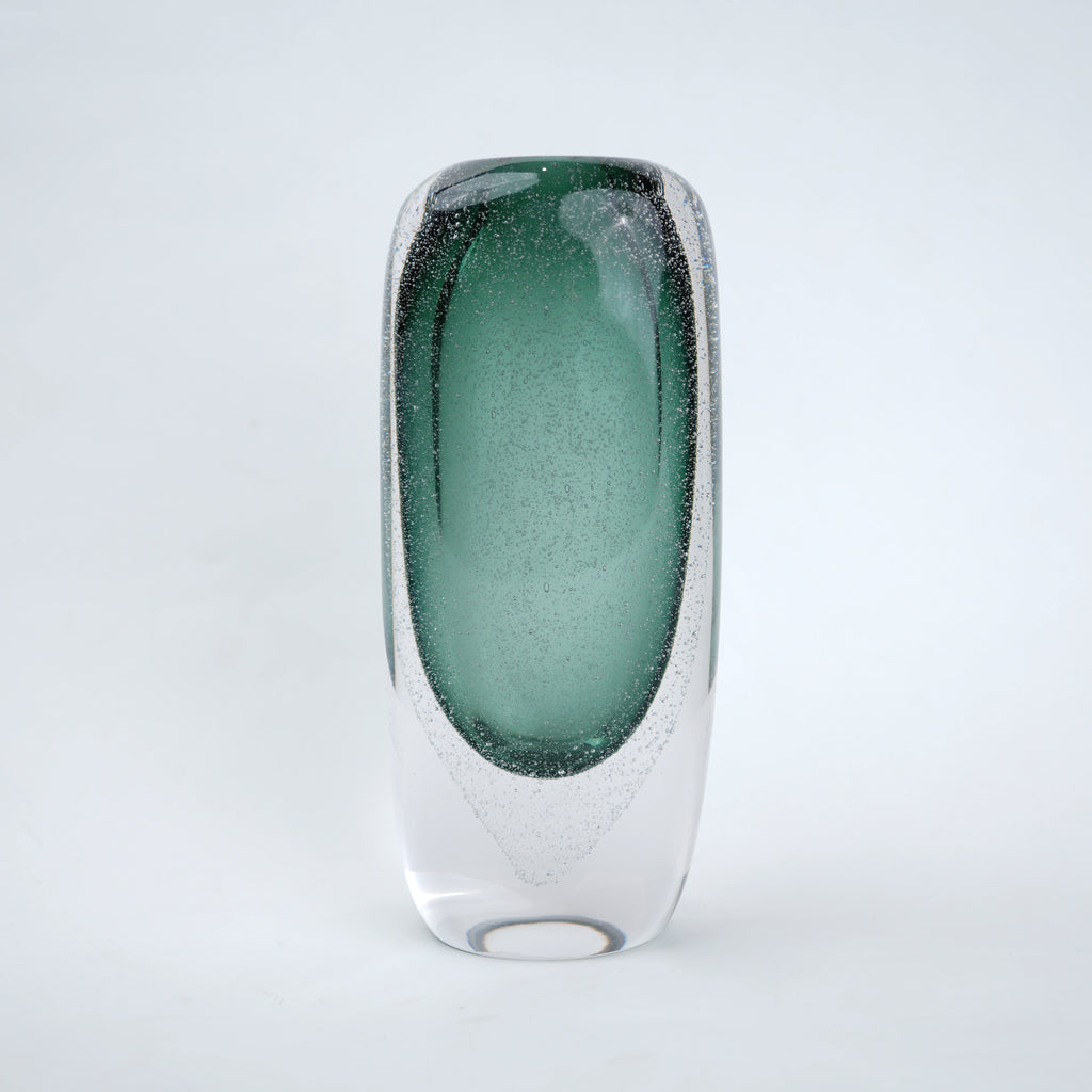 Decorative art glass vase with green gradient center encased inside clear glass body.