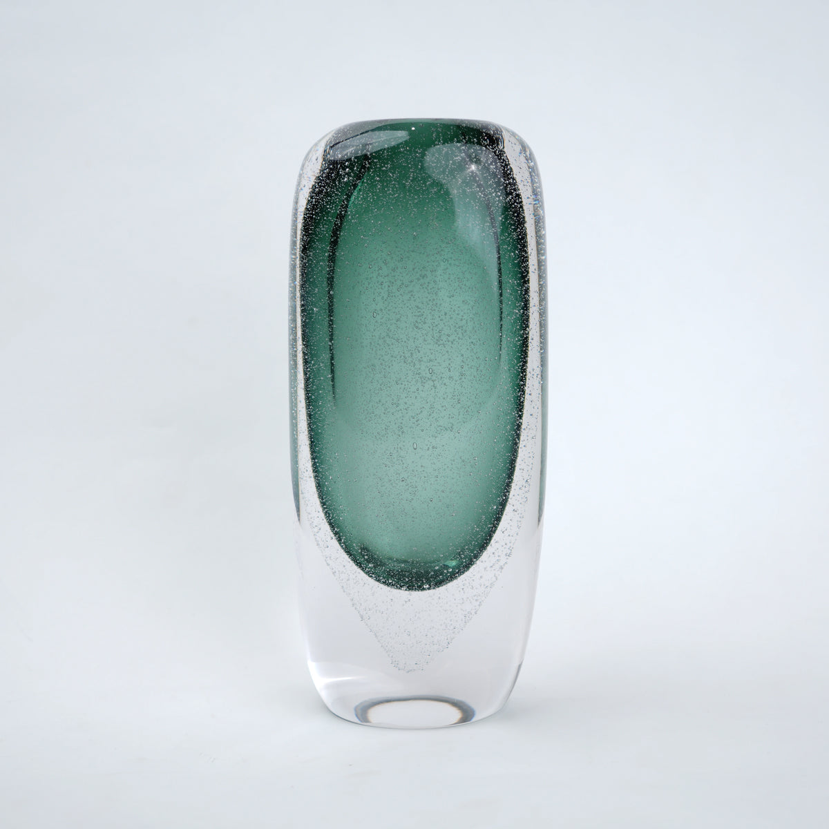 Decorative art glass vase with green gradient center encased inside clear glass body.