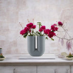 Grey dual curve vase w/ magenta mums