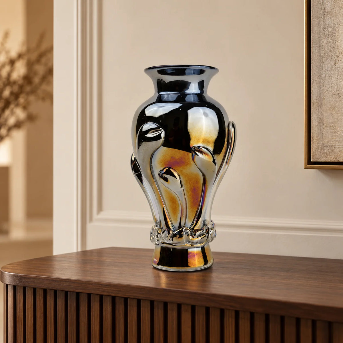 Chrome smoke reflective glass vase with curved body and metallic finish.