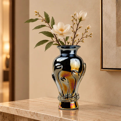 Chrome smoke reflective glass vase with curved body and metallic finish.