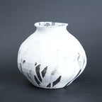 Round ivory ash vase, dark grey backdrop