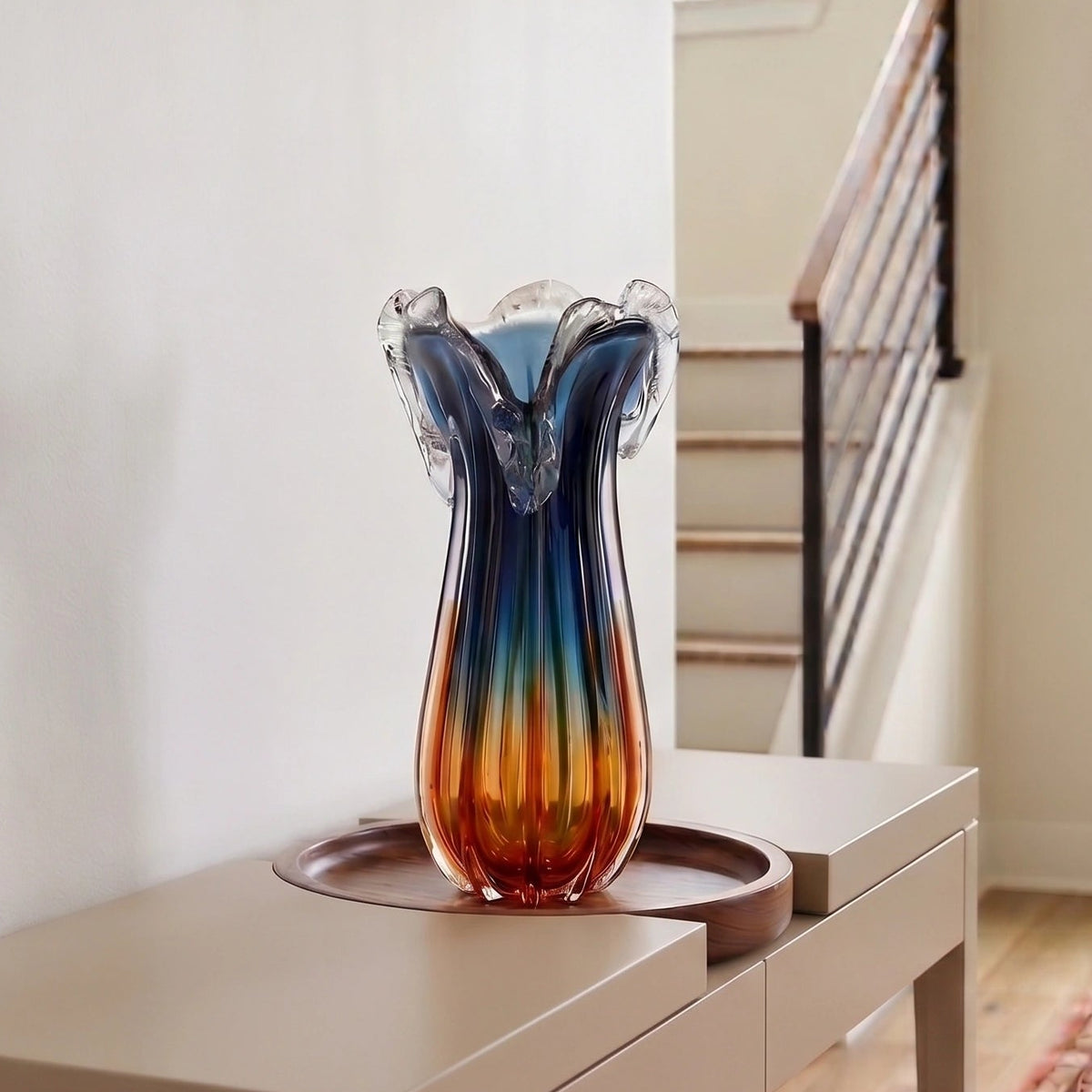 Blue gradient glass vase with multicolor base and clear flared rim