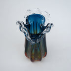 Blue gradient glass vase with multicolor base and clear flared rim