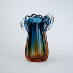 Blue gradient glass vase with multicolor base and clear flared rim