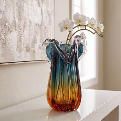 Blue gradient glass vase with multicolor base and clear flared rim