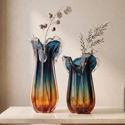 Blue gradient glass vase with multicolor base and clear flared rim
