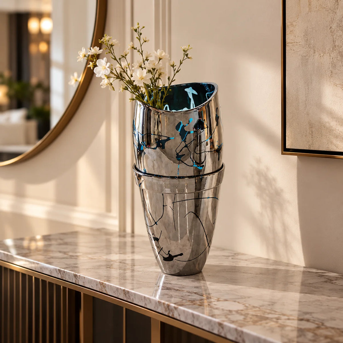 Silver splatter vase w/ white roses by window