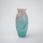 Textured marble-effect glass vase with soft gradient finish and rounded silhouette.