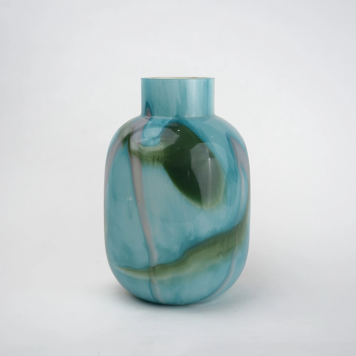Blue marble effect glass vase with a smooth glossy finish, featuring a rounded body and short cylindrical neck, designed as a modern decorative piece for home decor styling.