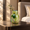 Blue marble effect glass vase with a smooth glossy finish, featuring a rounded body and short cylindrical neck, designed as a modern decorative piece for home decor styling.