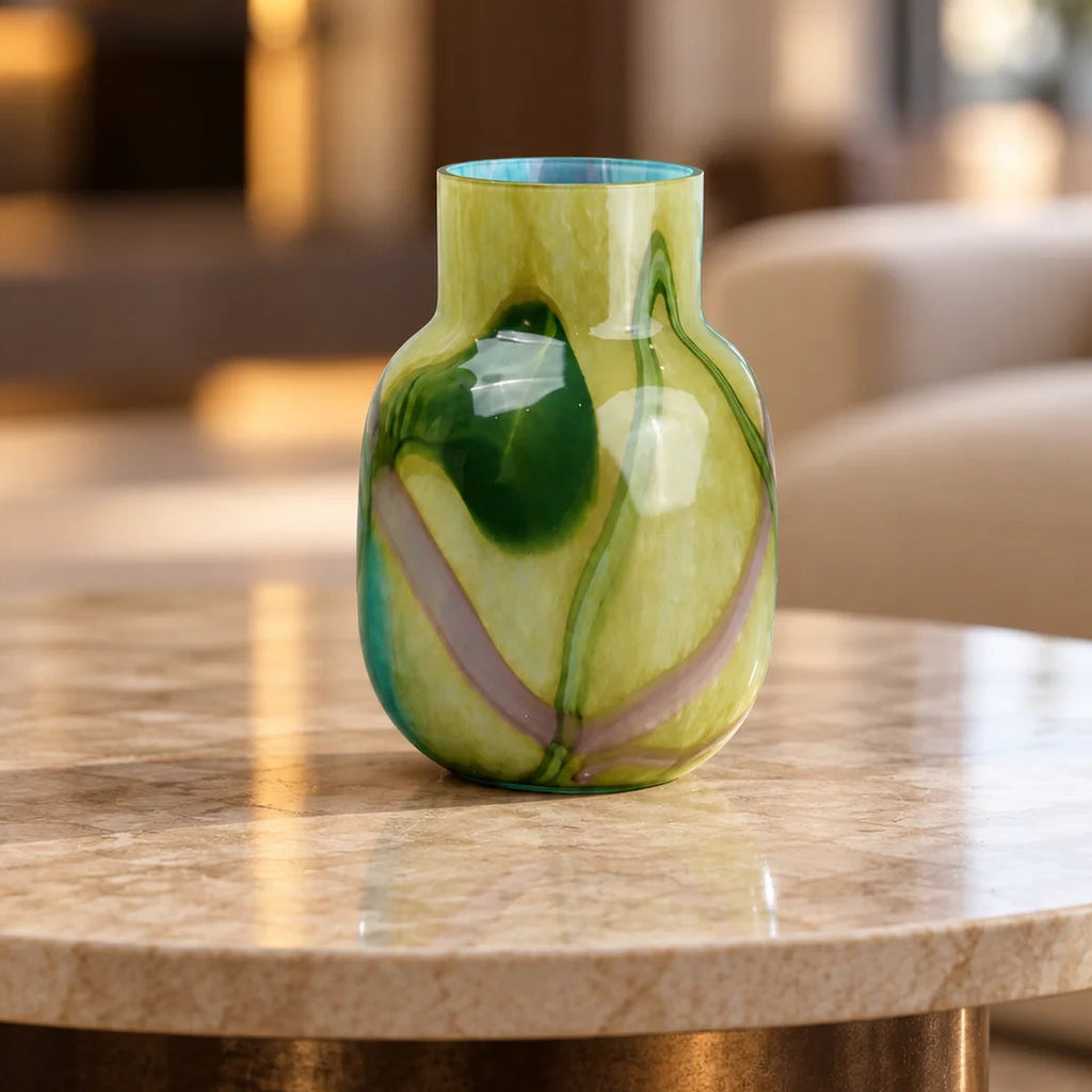 Blue marble effect glass vase with a smooth glossy finish, featuring a rounded body and short cylindrical neck, designed as a modern decorative piece for home decor styling.