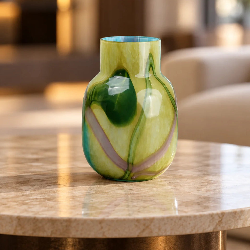 Blue marble effect glass vase with a smooth glossy finish, featuring a rounded body and short cylindrical neck, designed as a modern decorative piece for home decor styling.