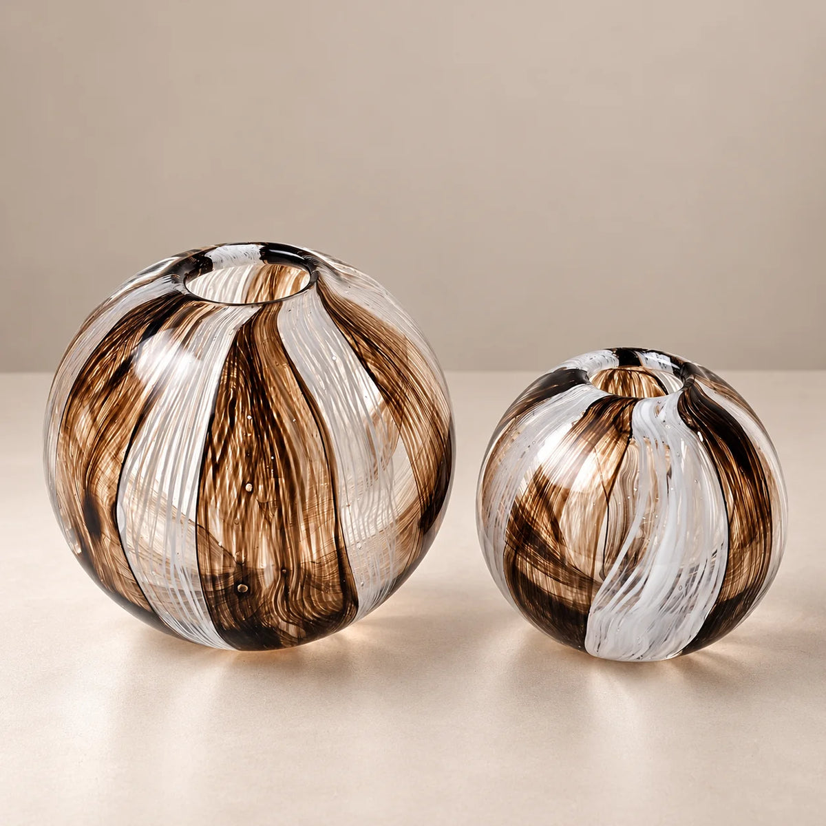 Two Bronze Elegance globe vases, scale shot