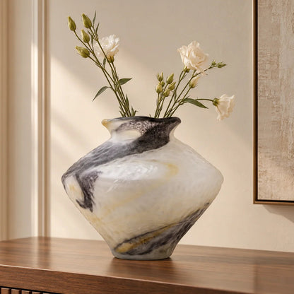 White marble art glass vase with organic pattern and wide asymmetrical form.
