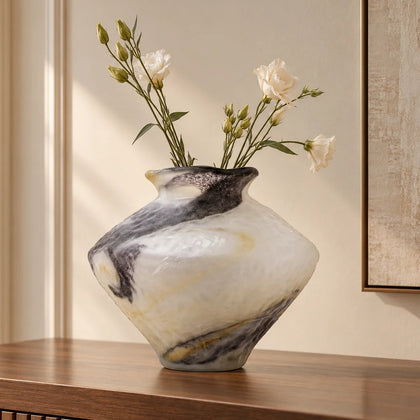 White marble art glass vase with organic pattern and wide asymmetrical form.