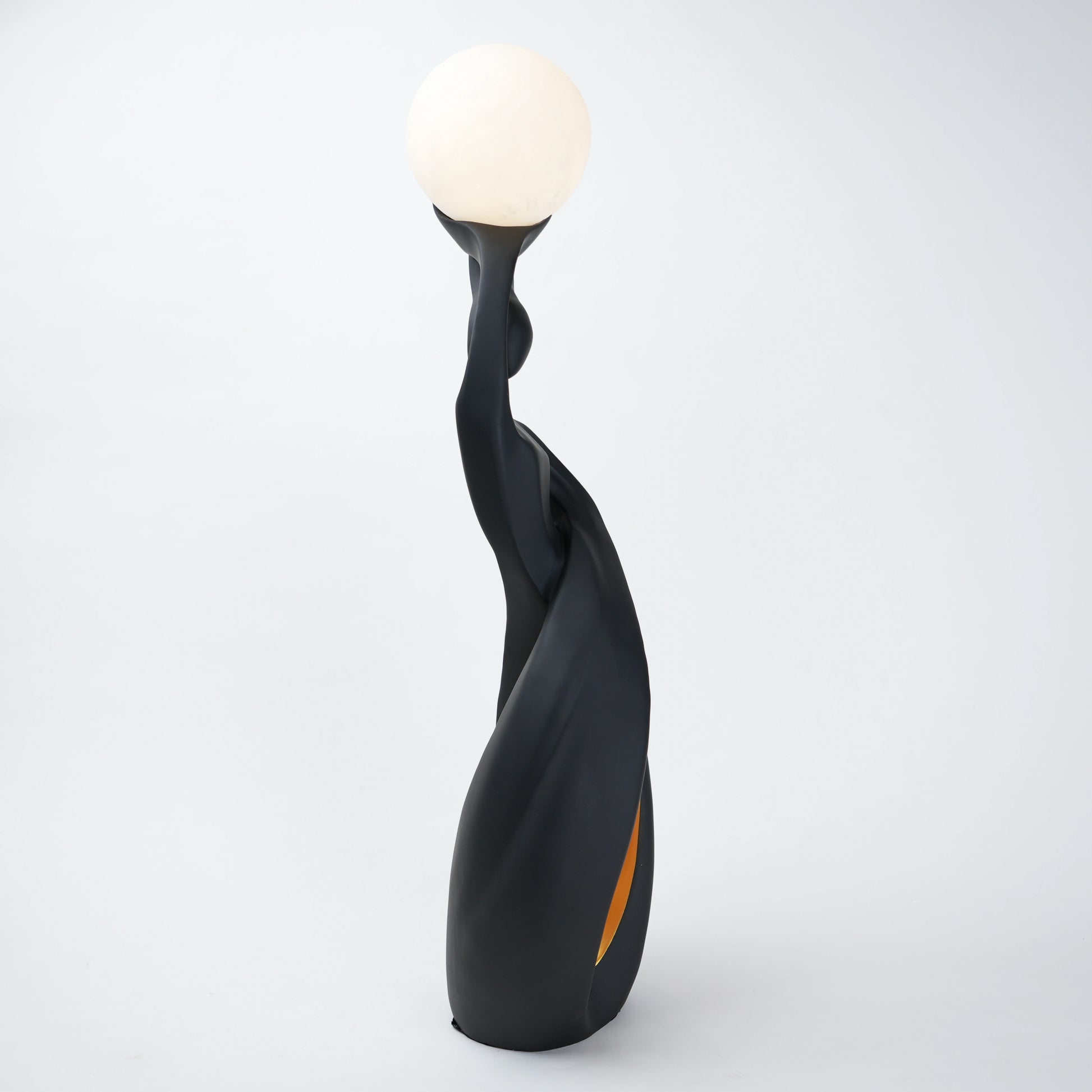 modern sculptural table lamp with glowing orb ambient lighting