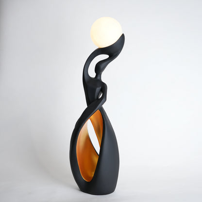 Modern black decorative lamp with a white bulb on a light gray background