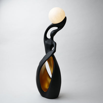 modern sculptural table lamp with glowing orb ambient lighting