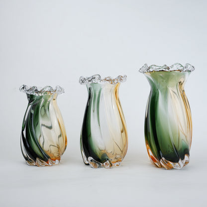 Glass vase with green and orange gradient on a white background