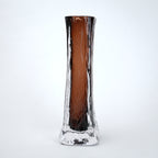 Glass vase with brown and clear design on a white background