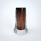 Decorative mocha glass vase featuring layered clear glass outer body and textured base with warm tone finish