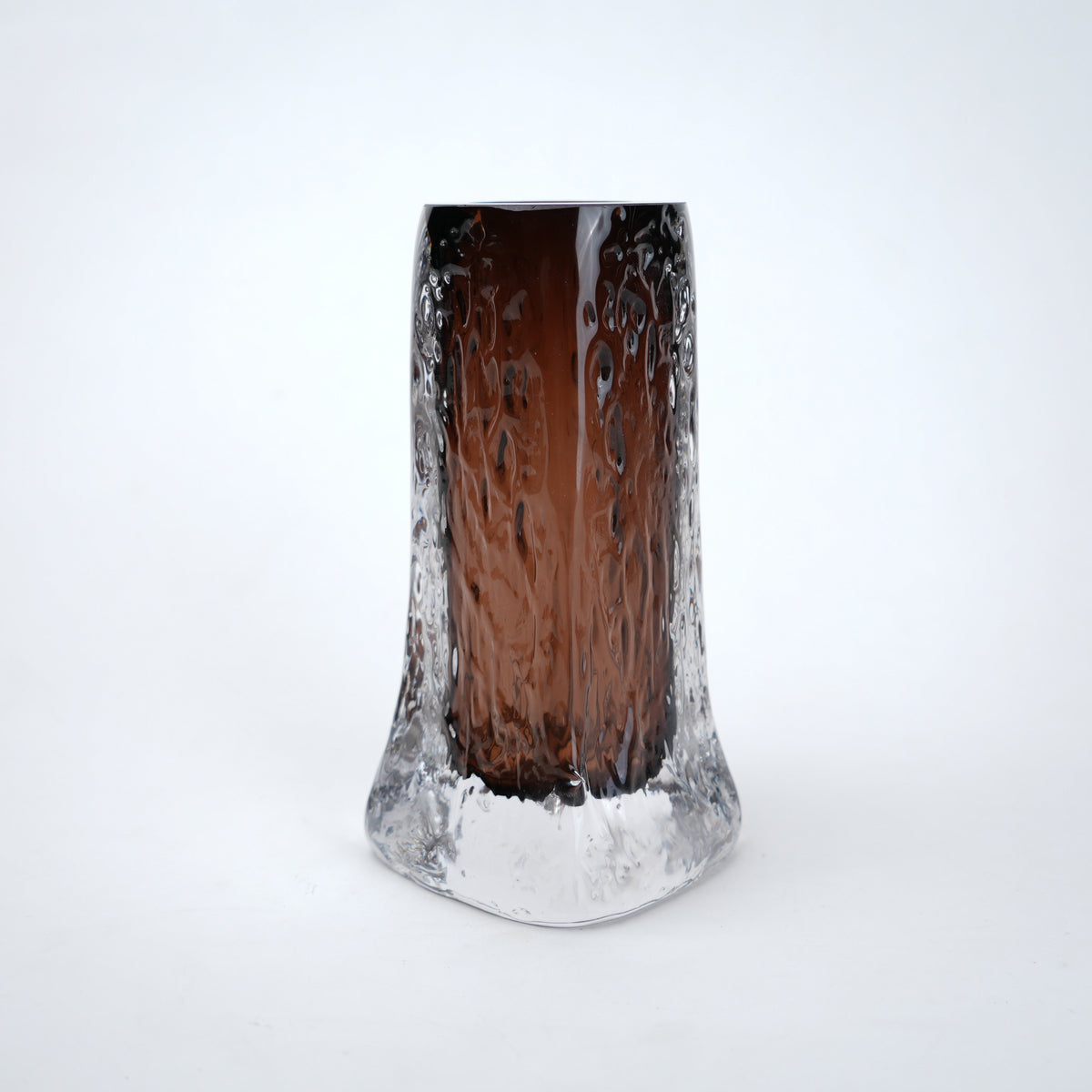 Decorative mocha glass vase featuring layered clear glass outer body and textured base with warm tone finish