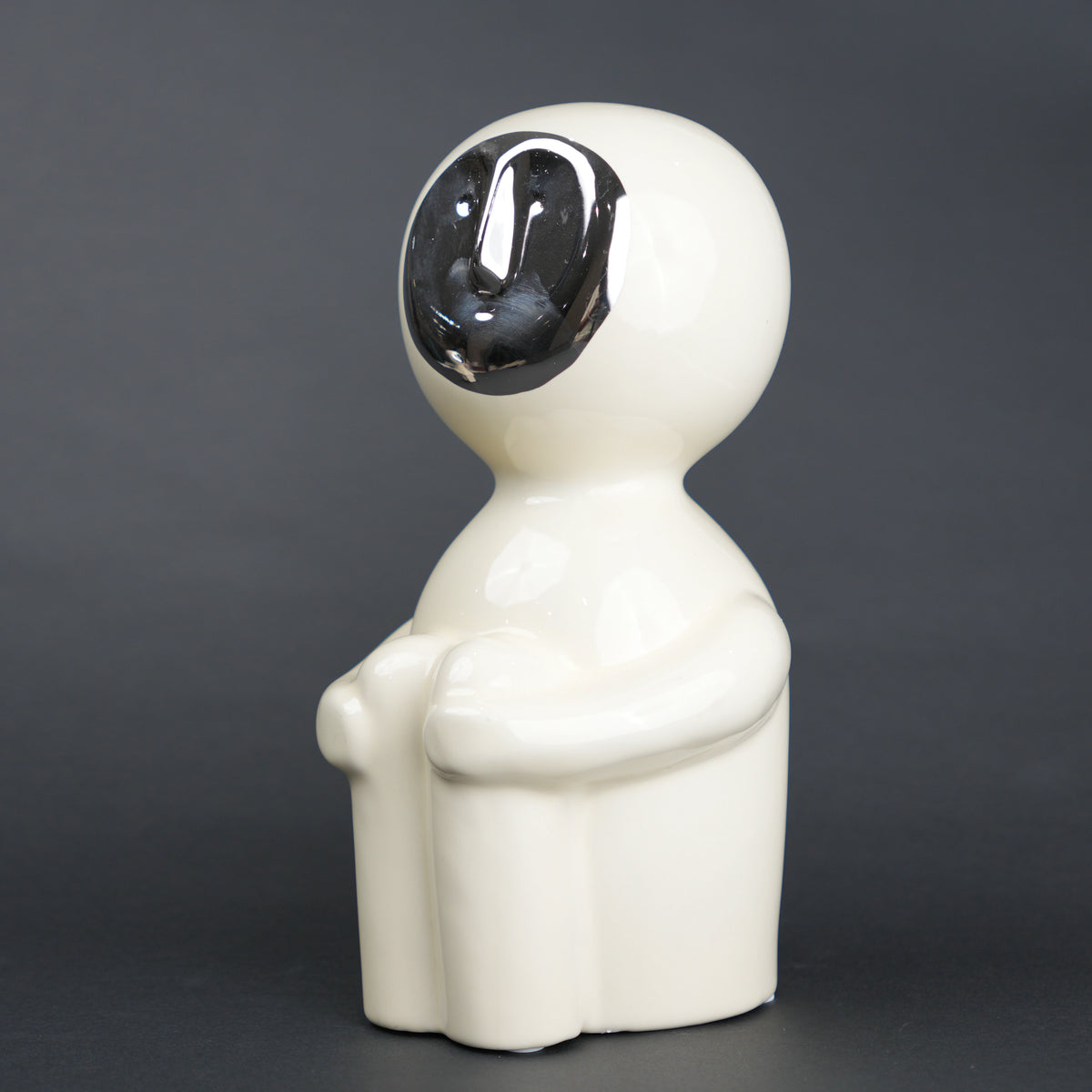 Modern human form decor in ivory white with chrome accent for contemporary home styling