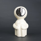 Modern human form decor in ivory white with chrome accent for contemporary home styling