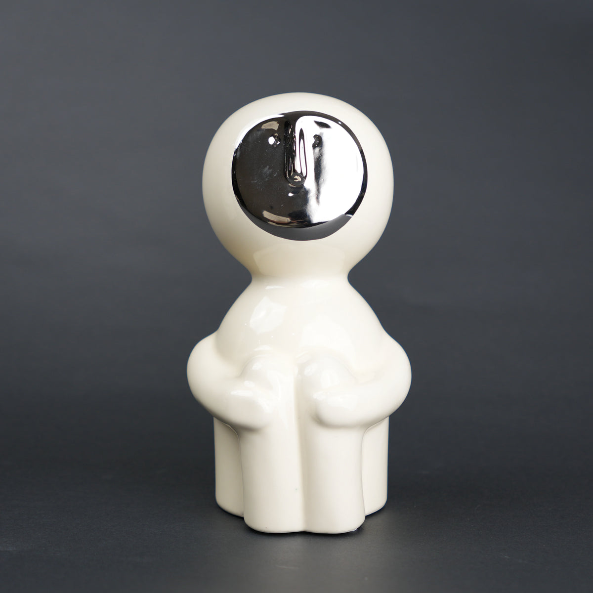 Modern human form decor in ivory white with chrome accent for contemporary home styling
