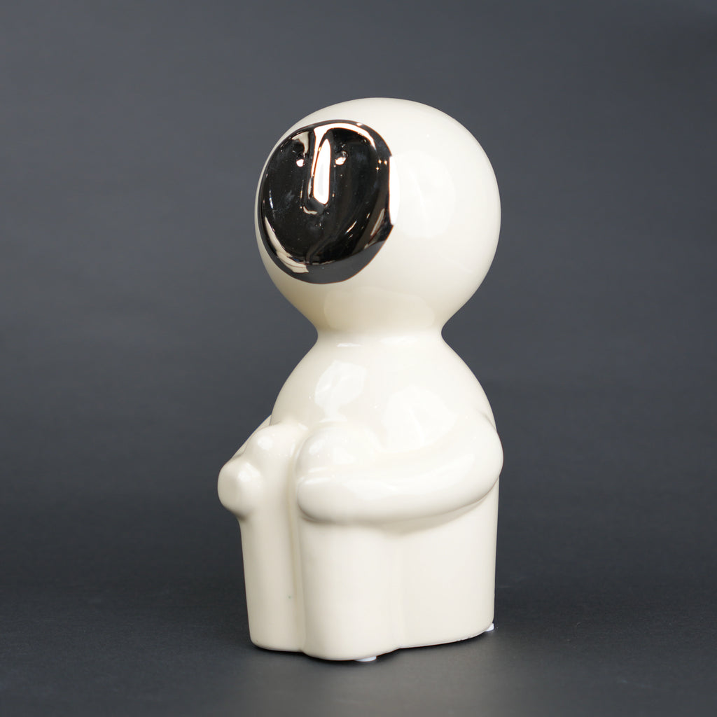 Modern human form decor in ivory white with chrome accent for contemporary home styling